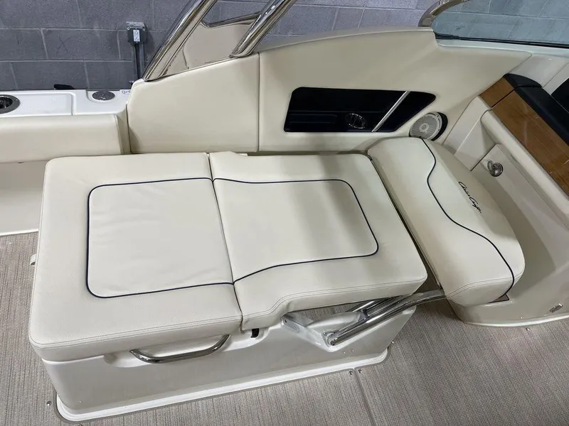 Slide: The Image of 2023 Chris-Craft 24 CALYPSO boat interior with beige seating and sleek design. - 20