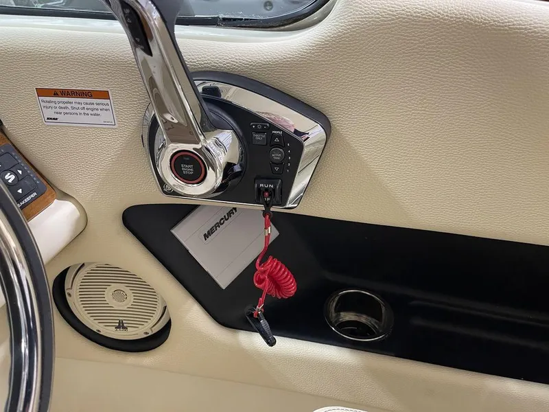 Slide: The Image of 2023 Chris-Craft 24 CALYPSO boat control panel with throttle and ignition switch. - 22