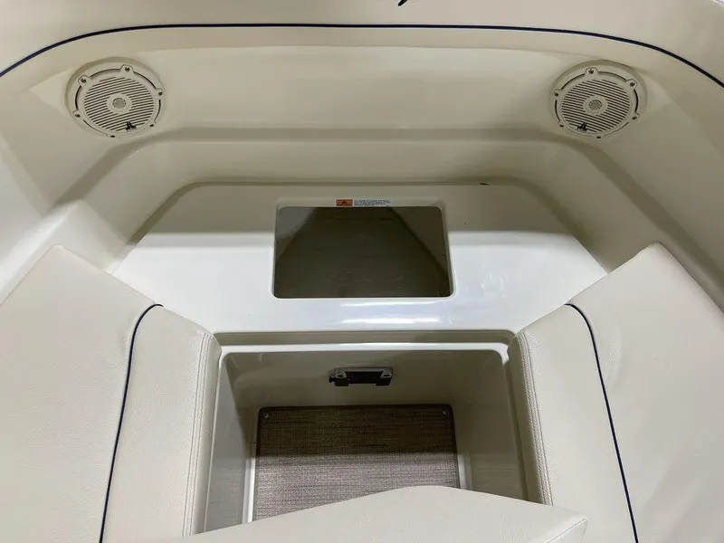 Slide: The Image of 2023 Chris-Craft 24 CALYPSO boat interior with speakers and seating area. - 30