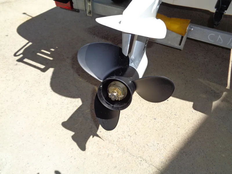 Slide: The Image of 2024 Carolina Skiff EL16JVX boat propeller on a trailer, close-up view. - 15