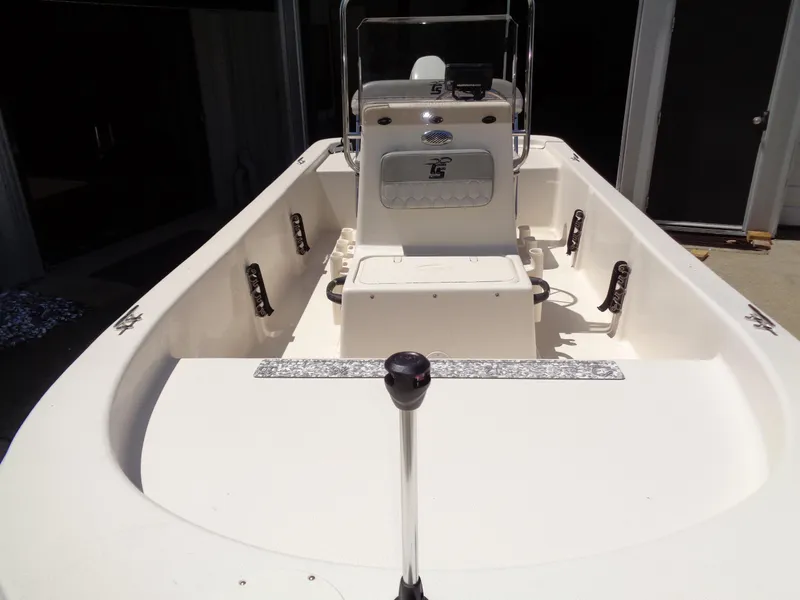 Slide: The Image of 2024 Carolina Skiff EL16JVX boat interior with console and seating. - 6