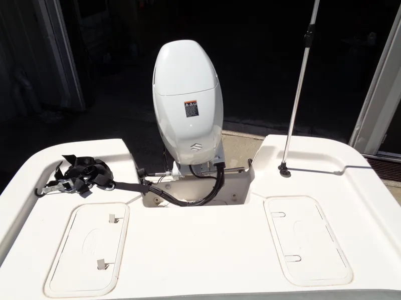 Slide: The Image of 2024 Carolina Skiff EL16JVX boat with outboard motor, rear view. - 9