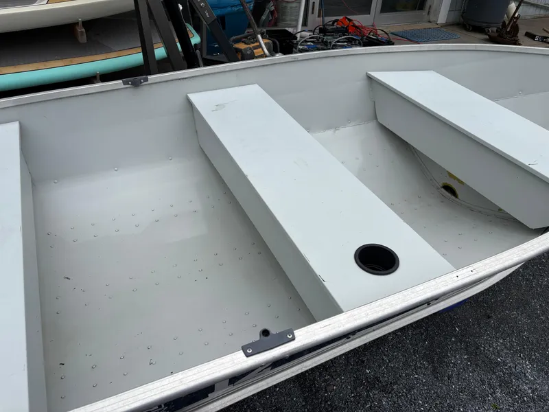 Slide: The Image of 2021 Duranautic 12 boat interior with bench seats and storage compartments. - 6