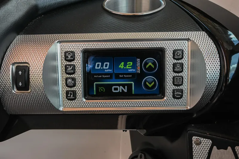 Slide: The Image of Dashboard of a 2013 MasterCraft XStar boat with digital display and controls. - 26