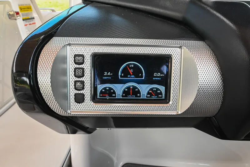 Slide: The Image of Dashboard of a 2013 MasterCraft XStar boat with digital gauges and controls. - 28