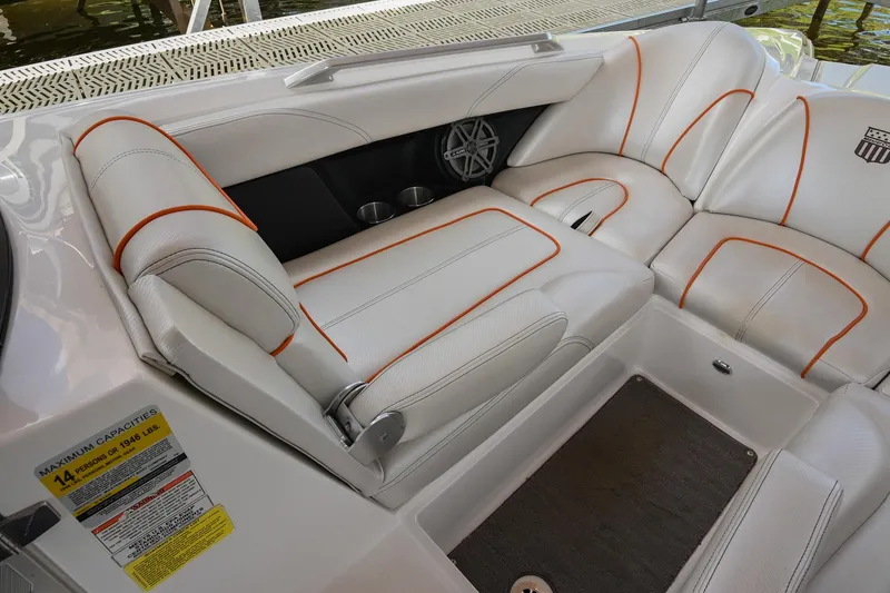 Slide: The Image of 2013 MasterCraft XStar interior with white leather seats and orange stitching. - 30