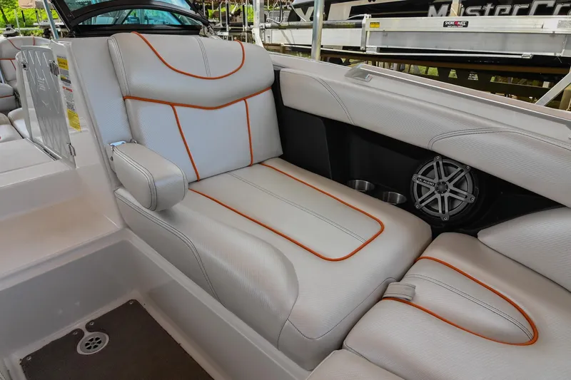 Slide: The Image of 2013 MasterCraft XStar interior with white leather seats and orange stitching. - 35