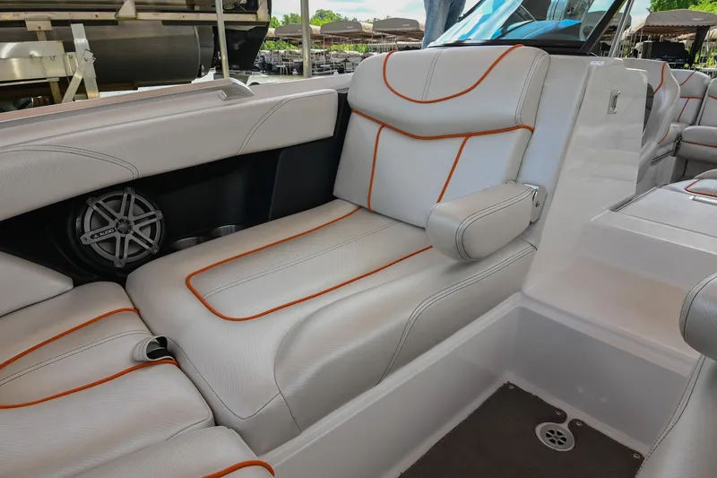Slide: The Image of 2013 MasterCraft XStar interior with white leather seats and orange stitching. - 36