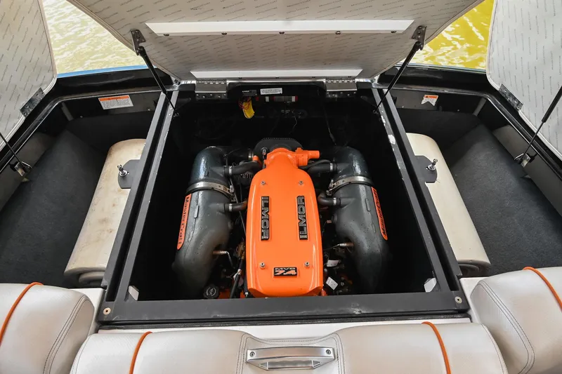 Slide: The Image of 2013 MasterCraft XStar engine compartment with orange Ilmor engine, open hatch view. - 40