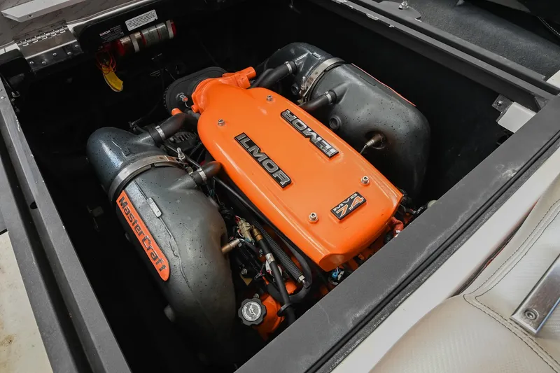 Slide: The Image of 2013 MasterCraft XStar engine compartment with Ilmor engine, showcasing performance components. - 41