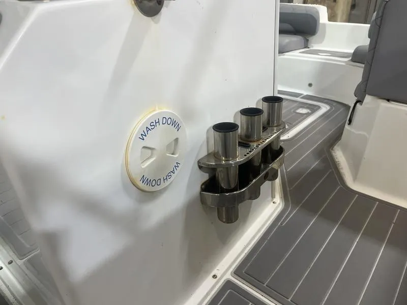 Slide: The Image of 2017 Hurricane 19 CC boat interior with wash down feature and rod holders. - 11