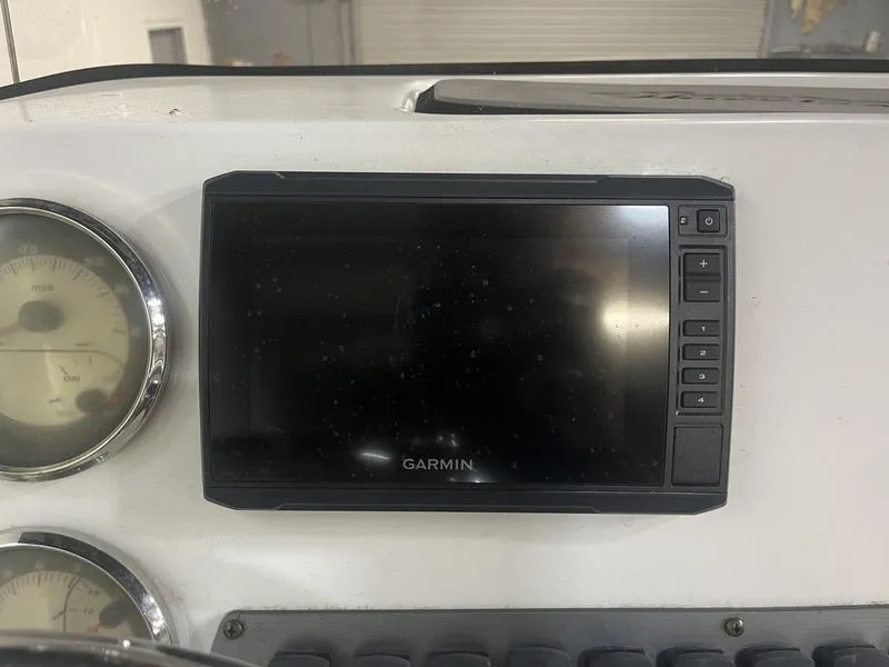 Slide: The Image of Garmin display on 2017 Hurricane 19 CC boat dashboard with gauges. - 8