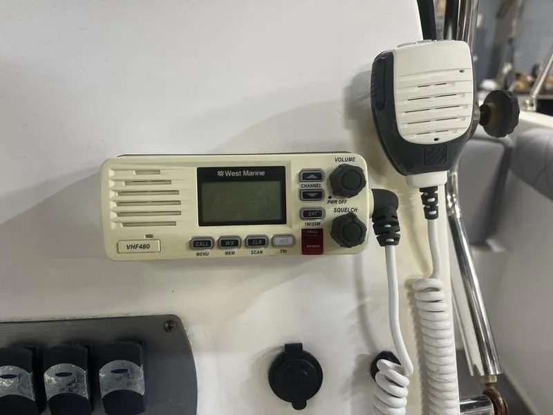 Slide: The Image of VHF marine radio on 2017 Hurricane 19 CC boat dashboard. - 9