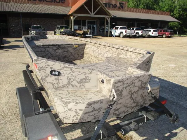 Slide: The Image of 2025 Reaper Boats 553-1426 camo-patterned boat on trailer in parking lot. - 4