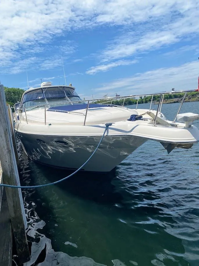 Slide: The Image of 2001 Sea Ray 460 Sundancer yacht docked on a sunny day. - 14