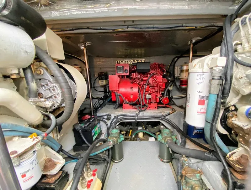 Slide: The Image of Engine room of a 2001 Sea Ray 460 Sundancer, showcasing mechanical components and systems. - 25