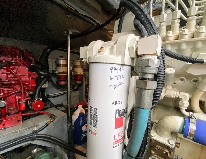 Slide: The Image of Engine room of 2001 Sea Ray 460 Sundancer with visible filter and components. - 28