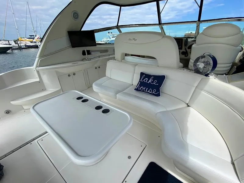 Slide: The Image of Interior of 2001 Sea Ray 460 Sundancer yacht with white seating and "lake house" pillow. - 30