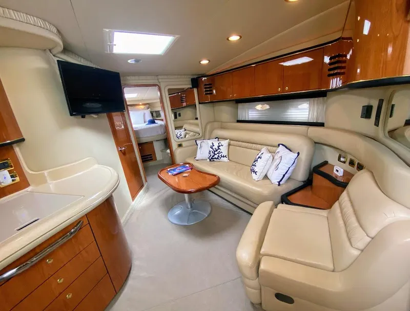 Slide: The Image of Luxurious interior of 2001 Sea Ray 460 Sundancer yacht with plush seating and modern amenities. - 4