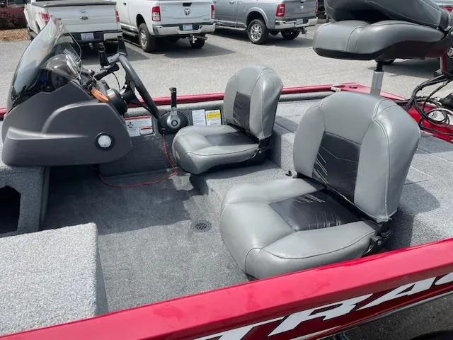 Slide: The Image of 2022 Tracker PRO170 boat interior with gray seats and steering console. - 3