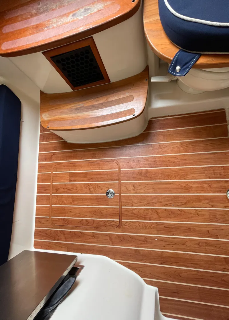 Slide: The Image of 2018 Grady-White Canyon 376 interior with wood flooring and seating. - 10