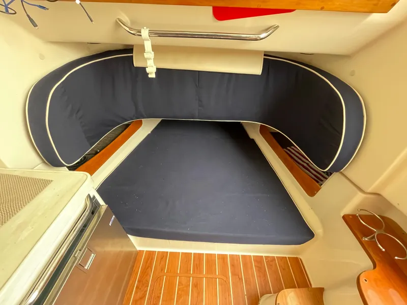 Slide: The Image of 2018 Grady-White Canyon 376 cabin interior with cushioned seating and wooden flooring. - 15