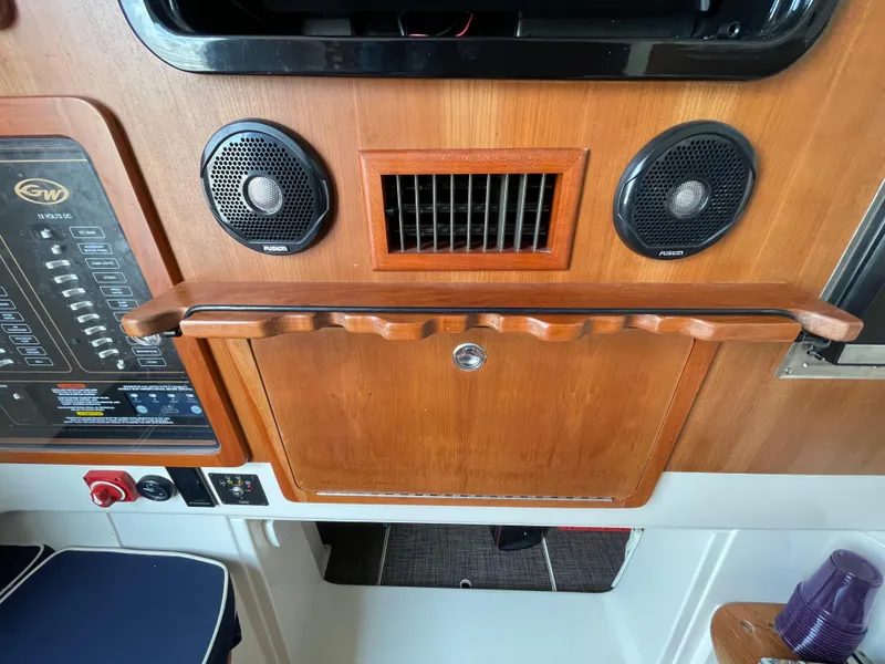 Slide: The Image of 2018 Grady-White Canyon 376 boat interior with control panel and speakers. - 19