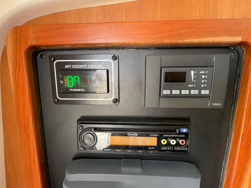 Slide: The Image of Control panel of a 2018 Grady-White Canyon 376 boat with electronic displays and audio system. - 23