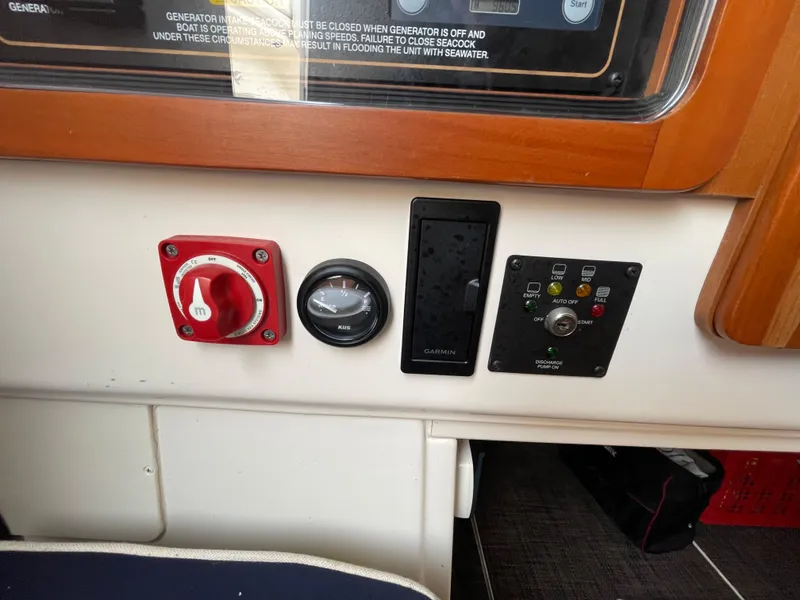 Slide: The Image of Control panel of 2018 Grady-White Canyon 376 boat with switches and gauges. - 24