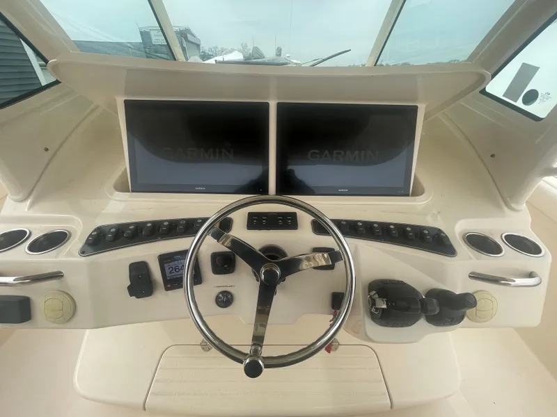 Slide: The Image of 2018 Grady-White Canyon 376 helm with dual Garmin displays and steering wheel. - 28