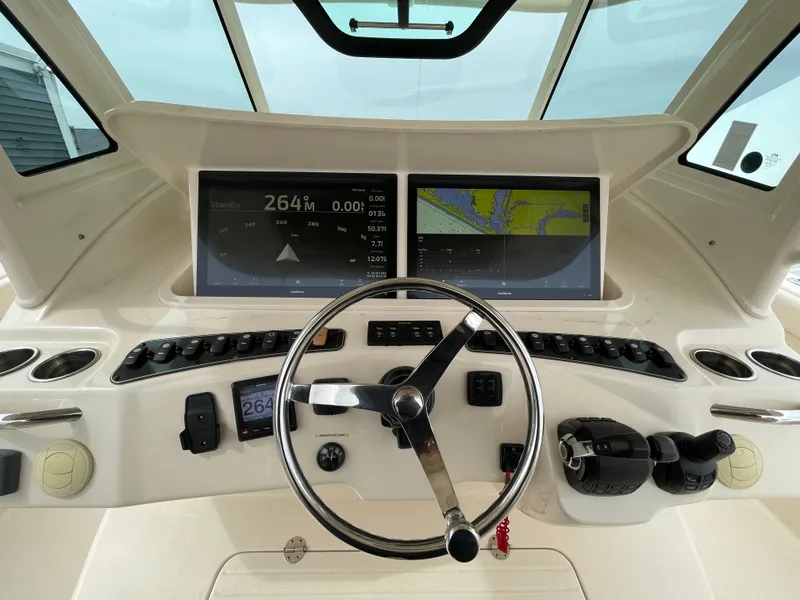 Slide: The Image of 2018 Grady-White Canyon 376 helm with dual displays and steering wheel. - 30
