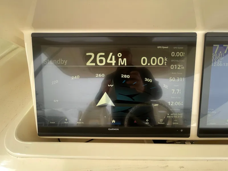 Slide: The Image of Garmin marine display on 2018 Grady-White Canyon 376 showing navigation data. - 32