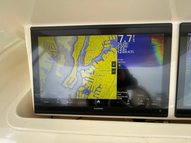 Slide: The Image of Garmin navigation display on 2018 Grady-White Canyon 376 boat, showing nautical chart details. - 34