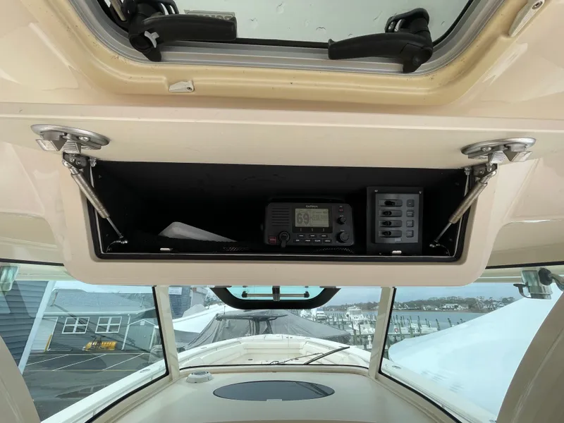 Slide: The Image of 2018 Grady-White Canyon 376 boat console with radio and control panel. - 37