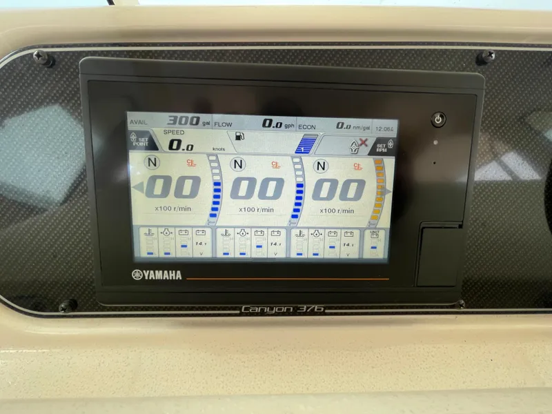 Slide: The Image of Yamaha display on 2018 Grady-White Canyon 376 boat dashboard showing engine metrics. - 38