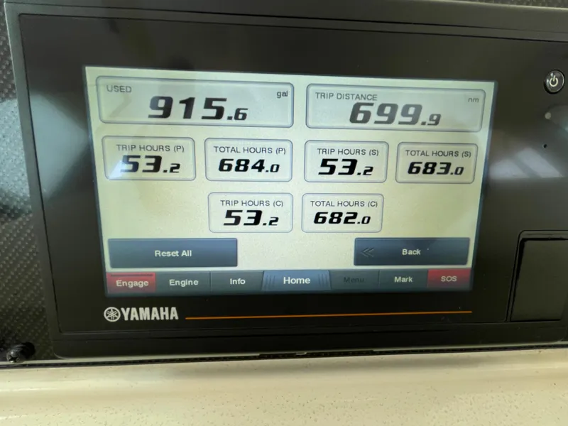 Slide: The Image of Yamaha display showing fuel usage, trip distance, and engine hours on a 2018 Grady-White Canyon 376. - 39