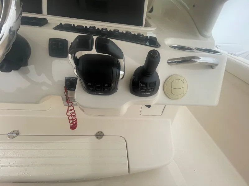 Slide: The Image of 2018 Grady-White Canyon 376 boat controls with joystick and throttle levers. - 40