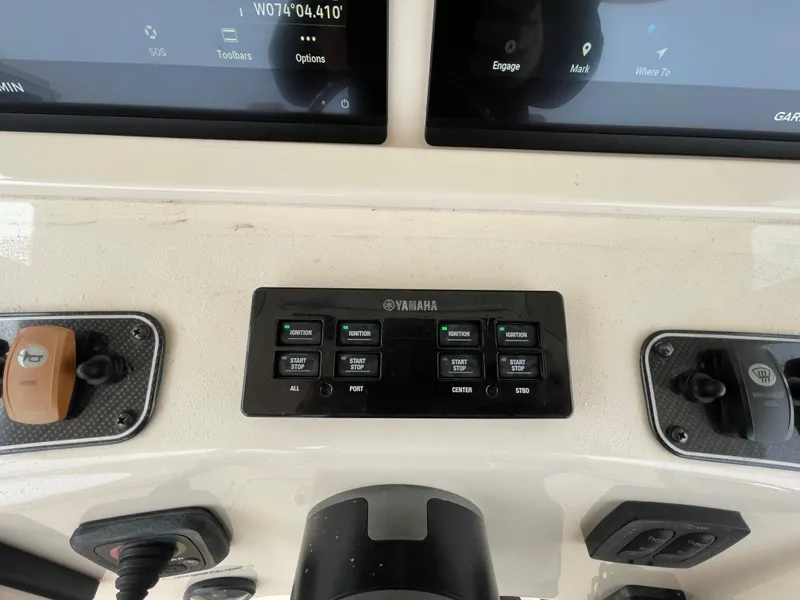 Slide: The Image of Control panel of a 2018 Grady-White Canyon 376 boat with Yamaha switches. - 41