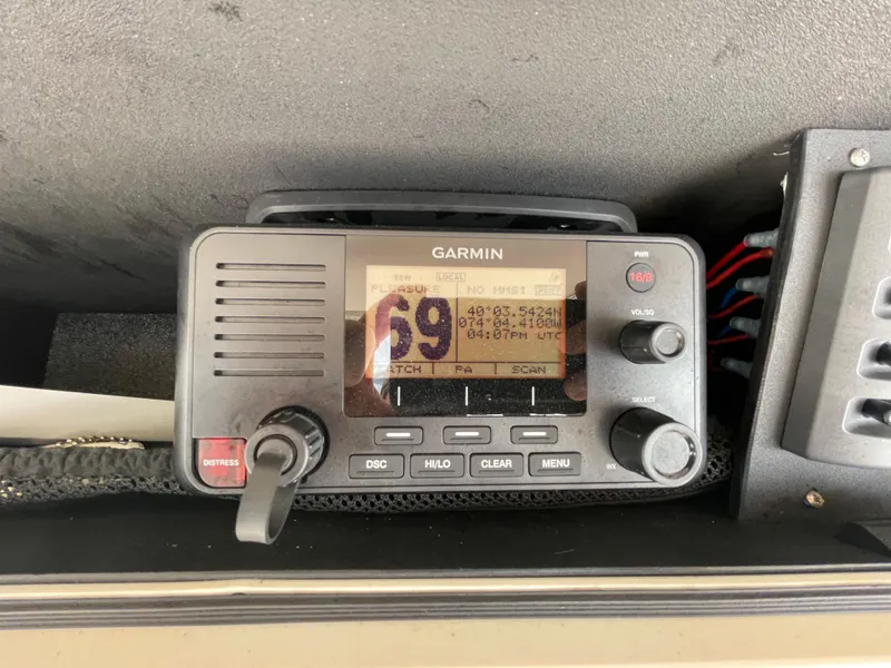 Slide: The Image of Garmin marine radio on 2018 Grady-White Canyon 376 boat dashboard. - 42