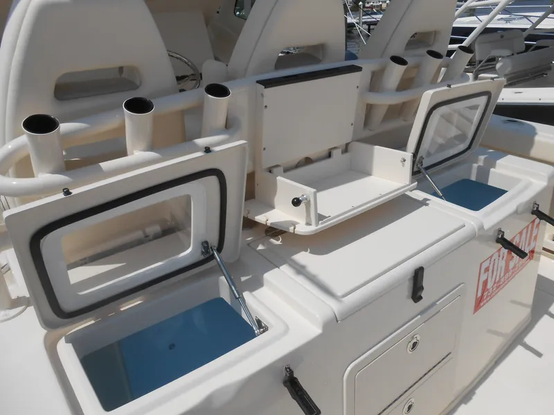 Slide: The Image of 2018 Grady-White Canyon 376 fishing boat with rod holders and storage compartments. - 45
