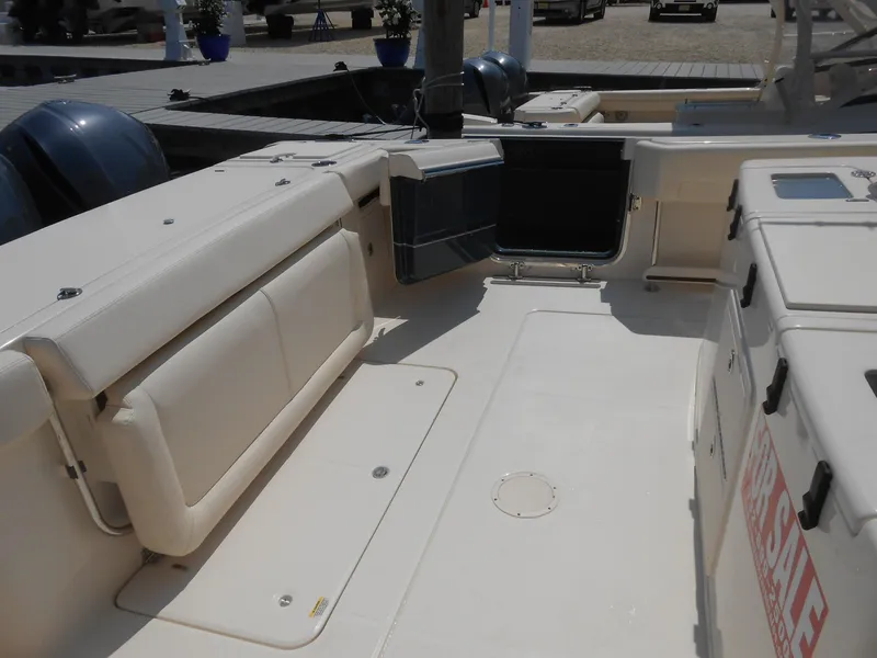 Slide: The Image of 2018 Grady-White Canyon 376 boat interior with seating and storage compartments. - 46