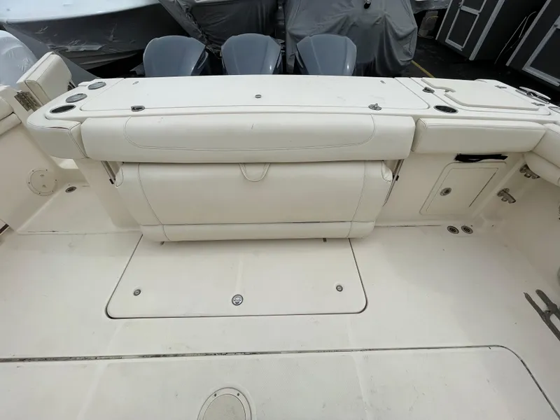 Slide: The Image of 2018 Grady-White Canyon 376 boat interior with cushioned seating and storage compartments. - 47