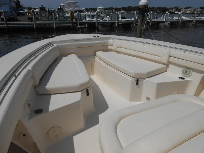 Slide: The Image of 2018 Grady-White Canyon 376 boat with spacious seating at a marina. - 5