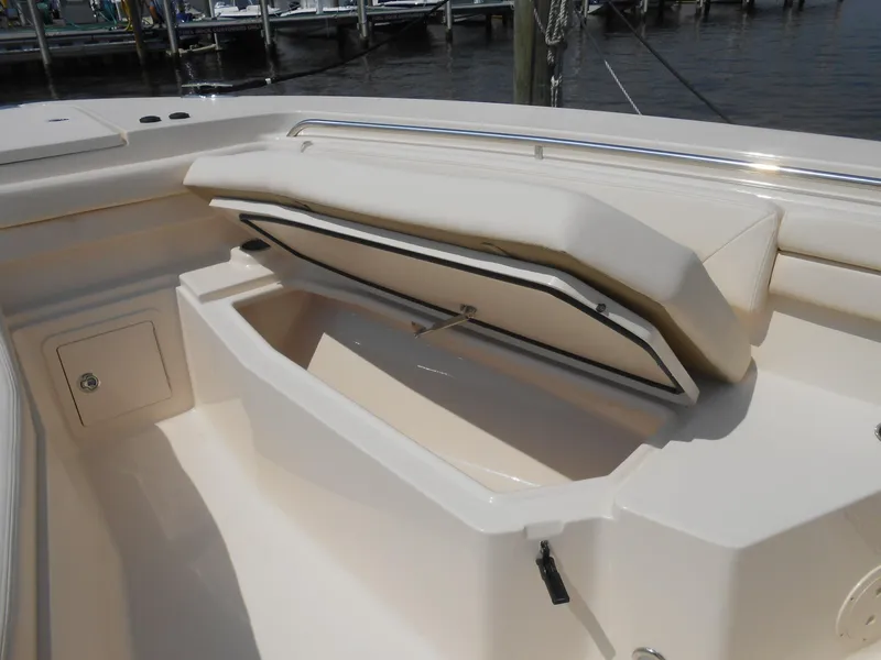 Slide: The Image of 2018 Grady-White Canyon 376 boat storage compartment open, docked at marina. - 7
