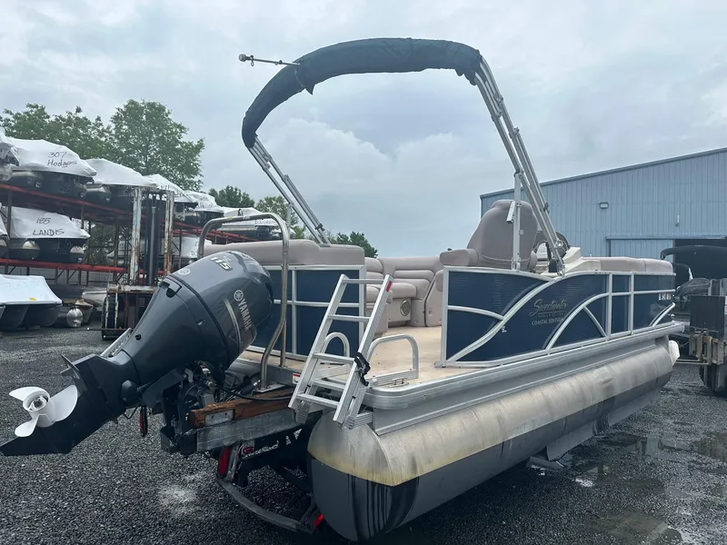Slide: The Image of 2015 Godfrey Sweetwater 20PE pontoon boat with Yamaha outboard motor, parked outdoors. - 1