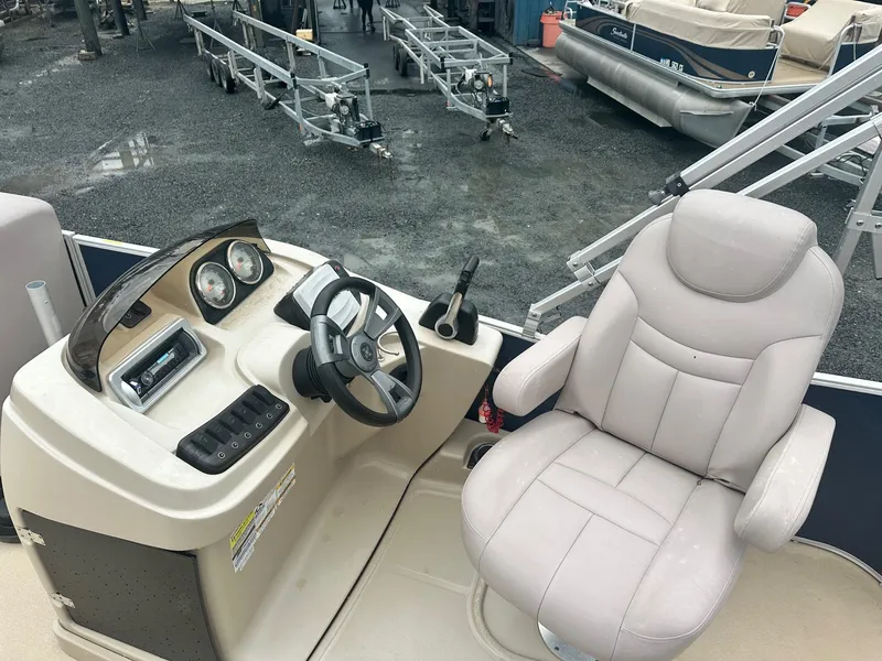 Slide: The Image of Captain's seat and console of 2015 Godfrey Sweetwater 20PE pontoon boat. - 3