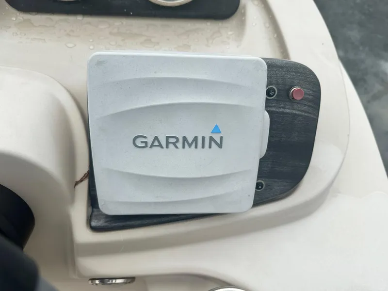 Slide: The Image of Garmin device on 2015 Godfrey Sweetwater 20PE boat dashboard. - 6