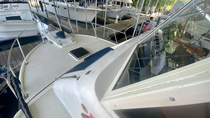 Slide: The Image of 1989 Kadey-Krogen Manatee 36 yacht docked, showcasing deck and cabin details. - 15