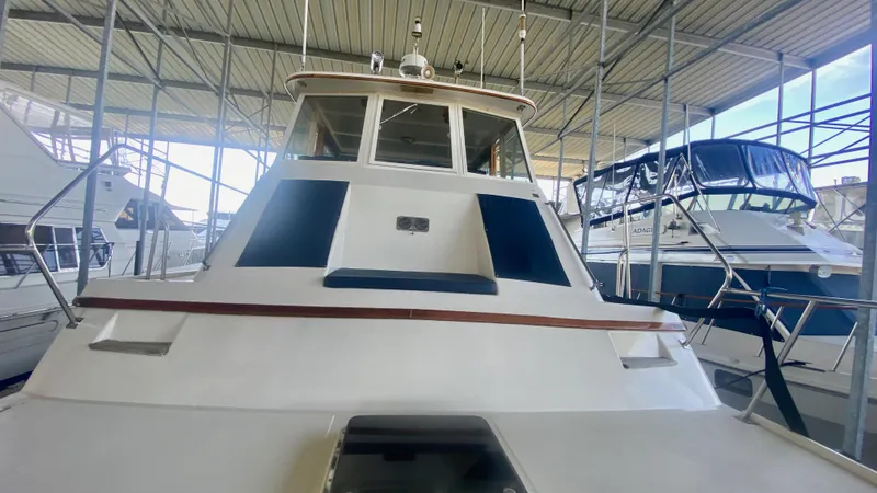 Slide: The Image of 1989 Kadey-Krogen Manatee 36 yacht docked in a covered marina. - 18