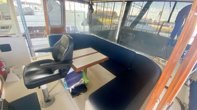 Slide: The Image of 1989 Kadey-Krogen Manatee 36 interior with seating area and captain's chair. - 21